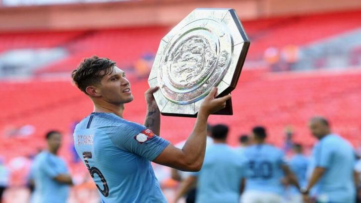 John Stones of Manchester City lifts the Community Shield